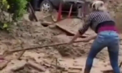 Mãe recebe a notícia da morte da filha após tentar encontrá-la cavando lama com enxada em Petrópolis, RJ